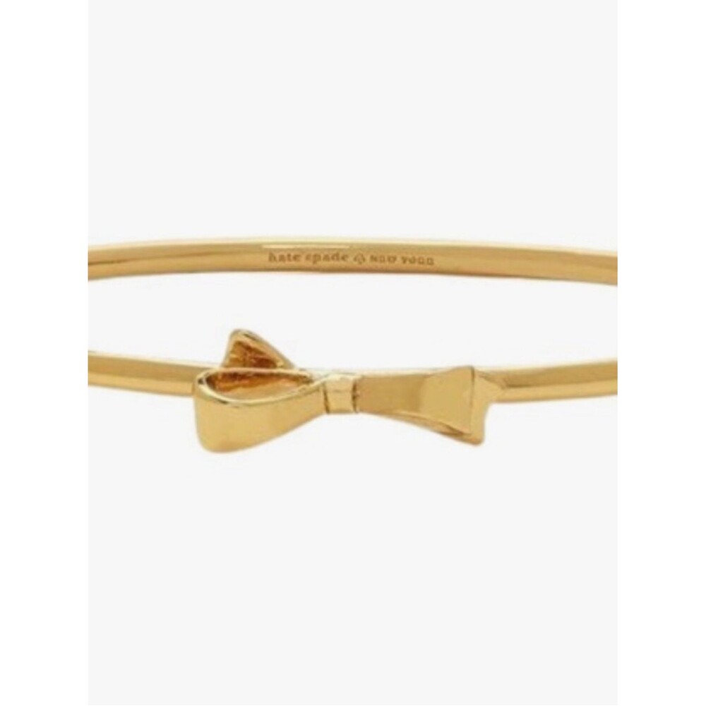 kate spade “love notes” gold bow bangle bracelet